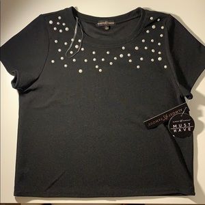 Beautiful cropped black top with pearl details.